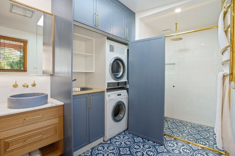 blue and gold with a bold tile modern laundry design